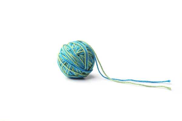 Colorful cotton thread ball from two color green and blue thread  isolated on white background.  Different color green and blue thread mix.