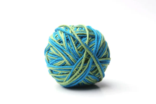 Colorful cotton thread ball from two color green and blue thread  isolated on white background.  Different color green and blue thread mix.