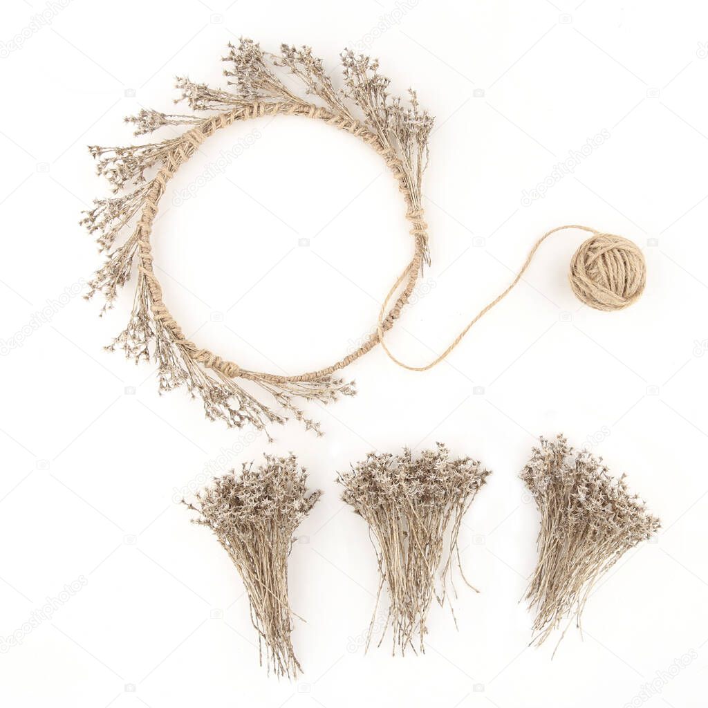 Wreath of dried grasses moss isolated on white background. Wild herbs or flowers decorations, diy concept.