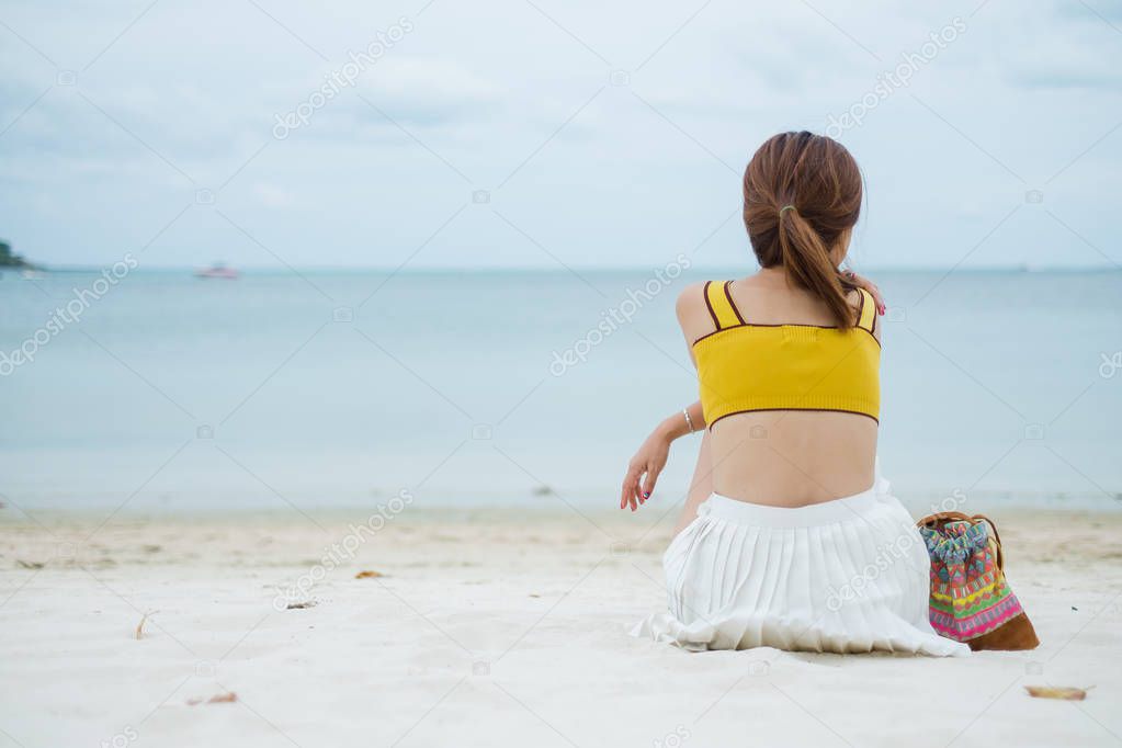 Young Woman Relaxing At Tropical Beach