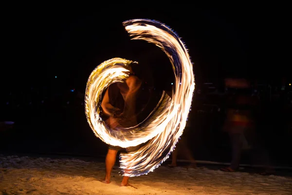 Amazing fire dancers Swing fire dancing show fire show on the beach  in Thailand