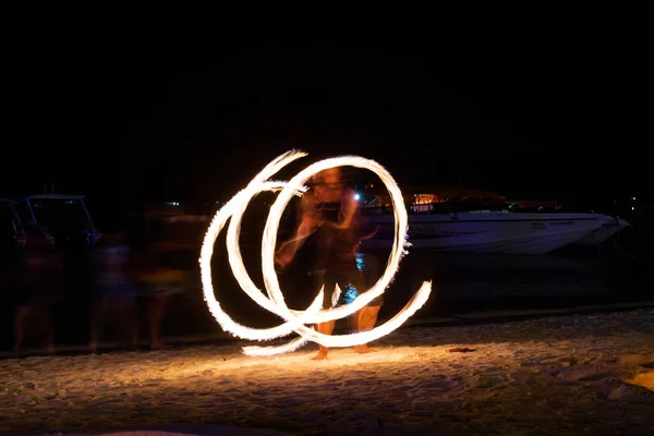 Amazing fire dancers Swing fire dancing show fire show on the beach  in Thailand