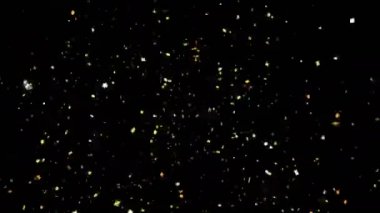 Altın konfeti parti Popper patlamalar bir siyah arka plan üzerinde