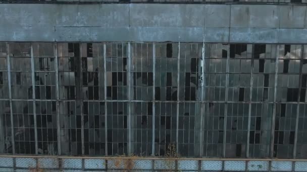 4k aerial view. Destroyed abandoned factory after the war, broken glass, destruction, frightening industrial composition — Stock Video