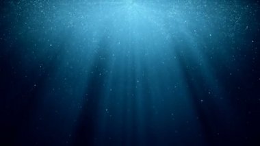 Arka plan ile yanıp sönen parçacıklar ışık ışınları ile mavi arka plan üzerinde parlayan hareket... VJ sorunsuz döngü.