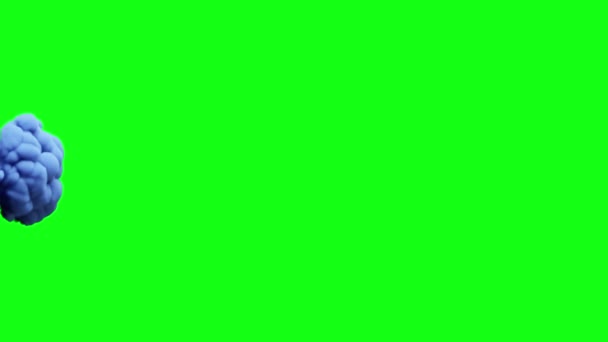 Tinta azul en cámara lenta en una pantalla verde croma clave verde de fondo — Vídeo de stock