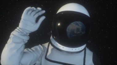 Astronot Dünya gezegeninin elini sallayarak uzayda Dünya Uzay giysisi yansıtılır