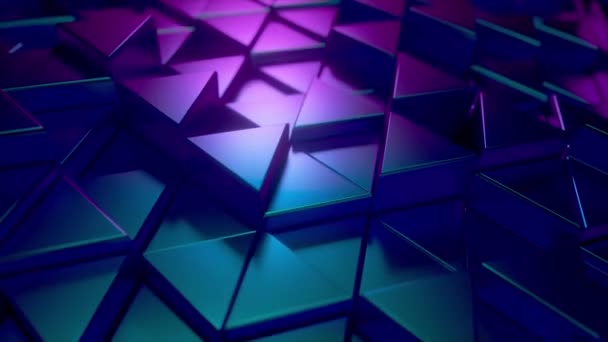 Abstract background of metal glossy triangles. Modern fashion lighting. Seamless loop 4k animation — Stock Video