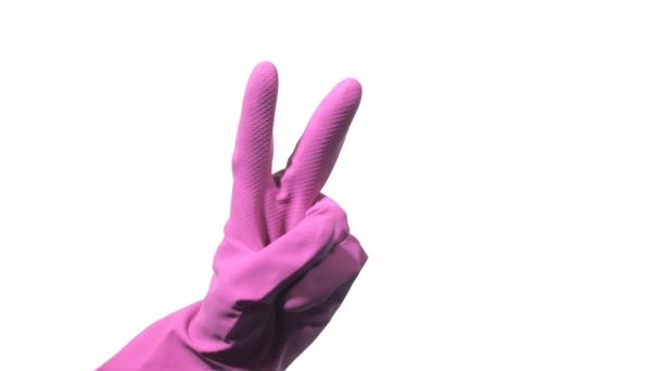 Cleaner hand in purple rubber glove gesturing victory on white background — Stock Video