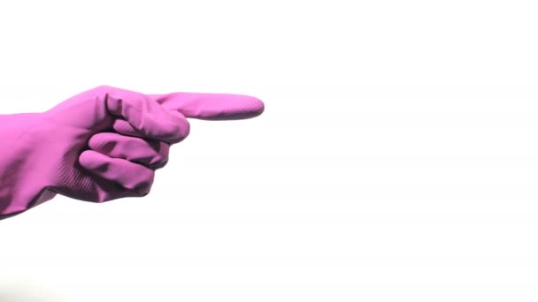 Hand with purple rubber glove is pointing towards on white background — Stock Video