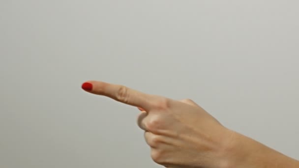 Woman hand pointing left. Gesture, sign, symbol. Communication with no talking concept. — Stockvideo