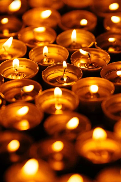 Burning Candles Many Yellow Candles Glow Dark Closeup — Stock Photo, Image
