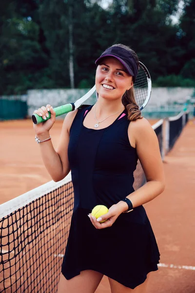 Beautiful sport woman tennis player with racket in sportswear