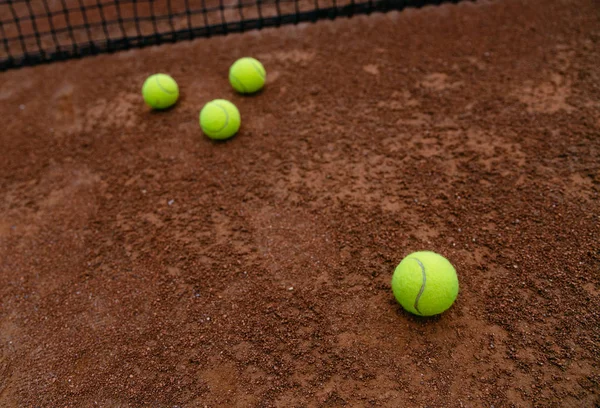 Close-up photo of tennis balls on the court