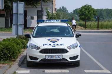 VUKOVAR, CROATIA - MAY 13, 2018: Croatian police forces car built by Ford. The Croatian police is also known as MUP, or Policija, and is controlled by the ministry of internal affairs clipart