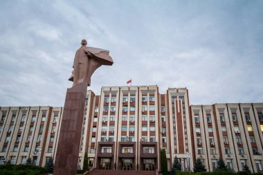 Transnistria Parliament building in Tiraspol with a statue of Vladimir Lenin in front. This is one of the main landmarks of the self proclaimed capital city of the republic of Transnistria clipart