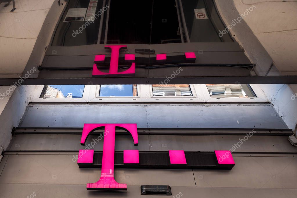 SZEGED, HUNGARY - JULY 3, 2018: T Mobile Logo on their main shop in Szeged. T-Mobile, is one of the main mobile network operator in Hungary belonging to Deutsche Telekom