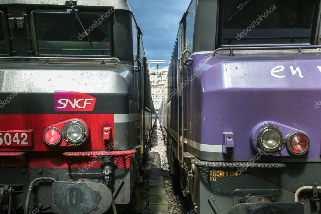 PARIS, FRANCE - AUGUST 19, 2006: Two trains ready for departure in Paris Gare de l'Est train station, with the logo of SNCF seen in front. This train station is one of the main hubs of Paris