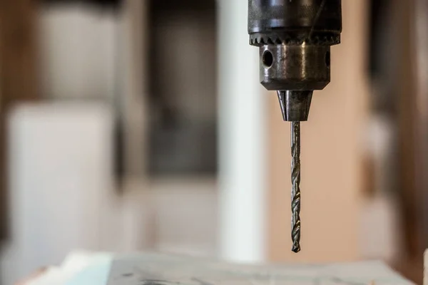 Close up on a professional grade wood drill bit used in a old retro carpentry workshop