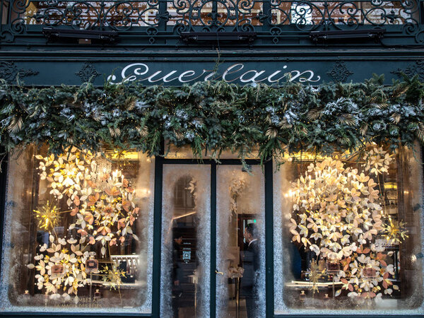 PARIS, FRANCE - DECEMBER 20, 2017: Guerlain logo on their boutique on Champs Elysees. Guerlain is a French house specialized in luxury frangrances, perfumes and cosmetics