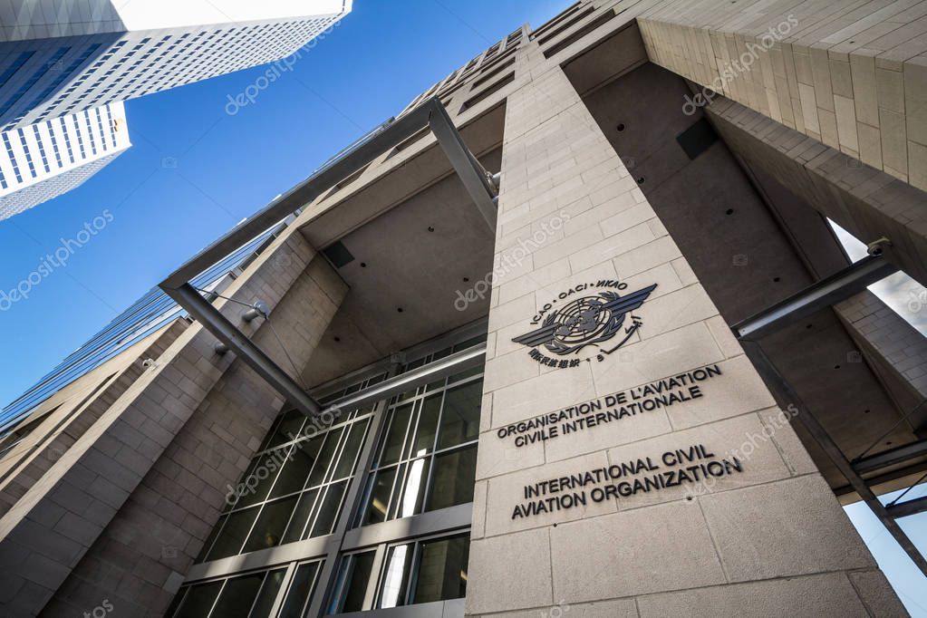 MONTREAL, CANADA - NOVEMBER 4, 2018: Logo of the international civil aviation organization, on their heaquarters office. Also called OACI, it's the UN body regulating civil aviation