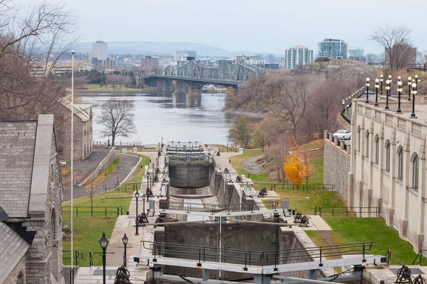 Rideau Canal Locks in Ottawa, Ontario, Canada, with Saint Lawrence river, Alexandra bridge and Gatineau Hull city in the background. The Canal and its locks are one of the landmarks of Ottawa