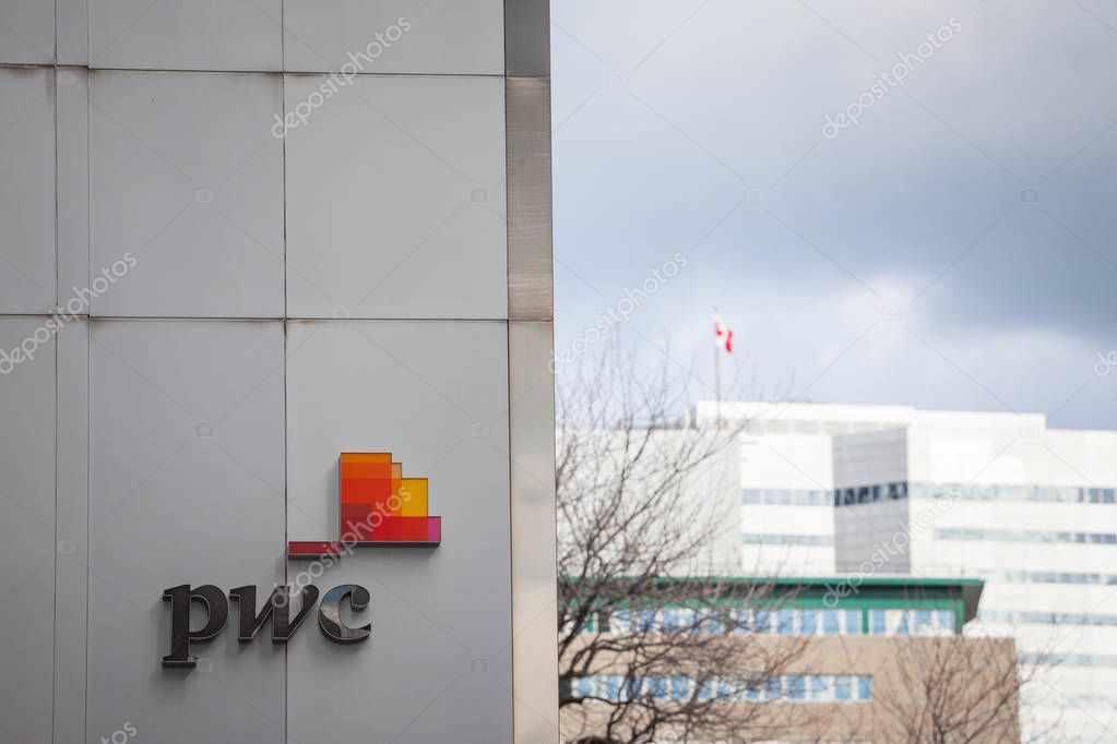 MONTREAL, CANADA - NOVEMBER 7, 2018: PWC logo on their main office for Quebec in Montreal, in a business district. PriceWaterHouseCoopers is one of  main audit firms in the world, within Big Four Group