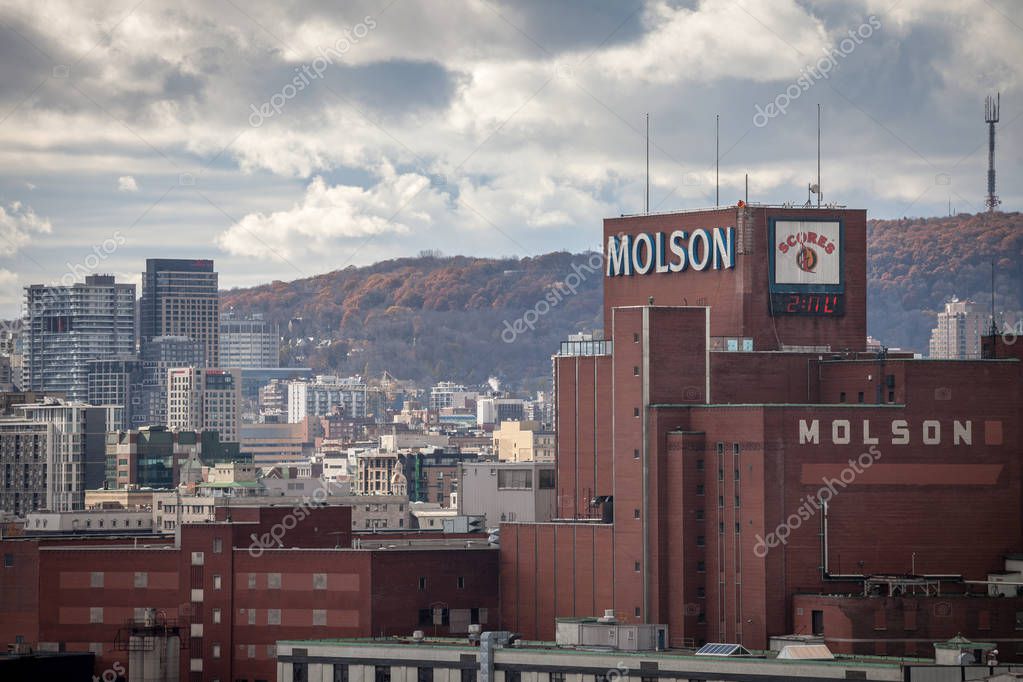 MONTREAL, CANADA - NOVEMBER 8, 2018: Molson Coors logo on Molson Brewery brick tower in downtown Montreal, Quebec. It is one of the biggest beer producers in the world, & a landmark