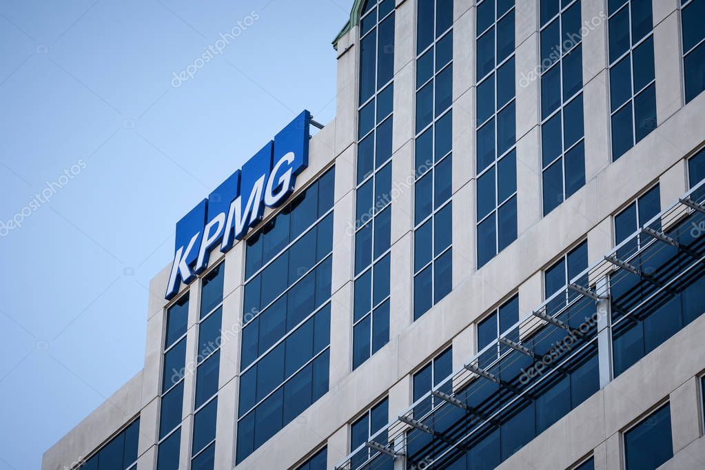 OTTAWA, CANADA - NOVEMBER 11, 2018: KPMG logo on their main office for Ottawa, Ontario, in a business district. KPMG is one of the main audit firms in the world, within the Big Four Group