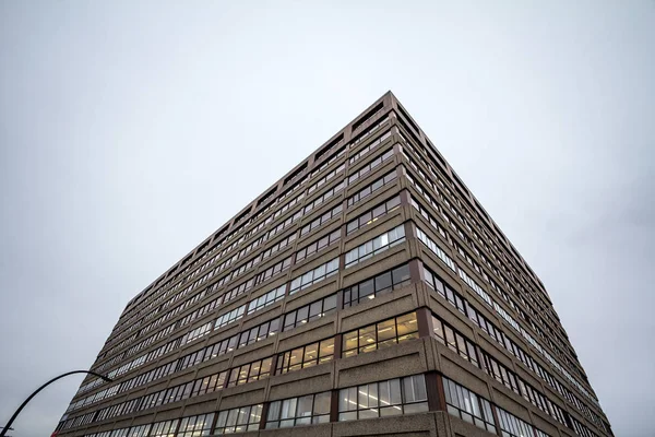 Facade of an old concrete industrial warehouse, office and factory building, north American style, in the suburbs of Montreal, in Quebec, Canada