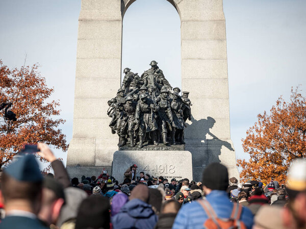 OTTAWA, CANADA - NOVEMBER 11, 2018: Crowd gathering on National War memorial of Ottawa, Ontario, Canada, on remembrance day to commemorate the canadians who died in conflicts