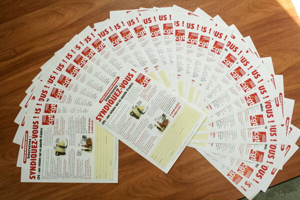 PARIS, FRANCE - OCTOBER 27, 2006: CGT logo on political tracts and pamphlets incitating to join the union. Confederation Generale du Travail is one of the main trade union in France
