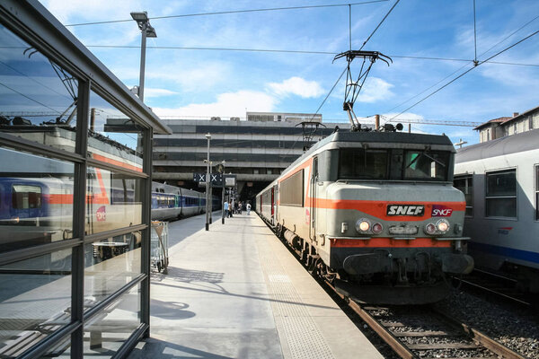 MARSEILLE, FRANCE - OCTOBER 29, 2006: Passenger TER Regional Train in Marseille Saint Charles train station, belonging to SNCF company seen in front. This train station is the main hub of Marseilles