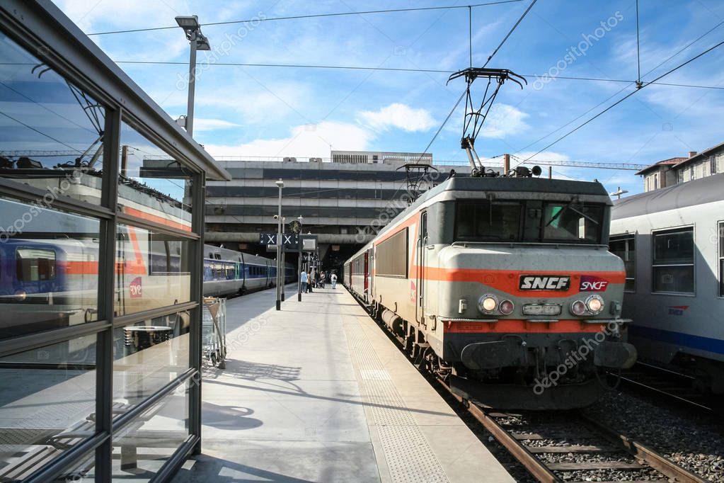 MARSEILLE, FRANCE - OCTOBER 29, 2006: Passenger TER Regional Train in Marseille Saint Charles train station, belonging to SNCF company seen in front. This train station is the main hub of Marseilles