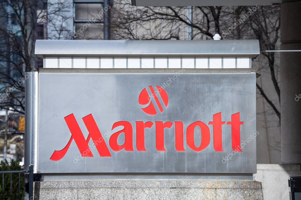 TORONTO, CANADA - NOVEMBER 14, 2018:  Marriott logo on their main hotel in Toronto, Ontario. Marriott Corporation is a worldwide brand, owner and franchise of luxury hotels