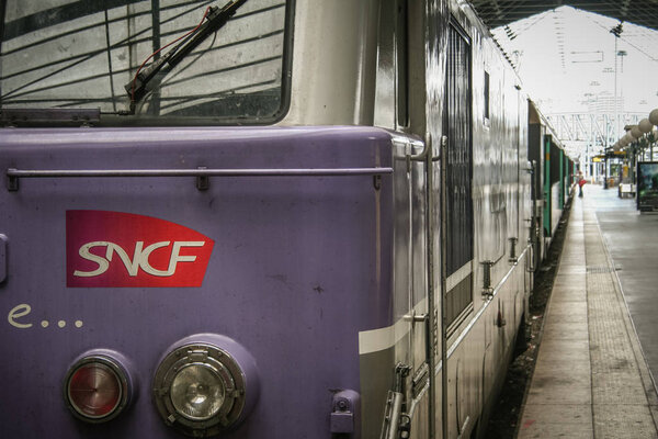 PARIS, FRANCE - JULY 13, 2011: Regional train with the logo of SNCF French Railways on a platform of Paris Gare du Nord Train station. This station is one of Paris main hubs