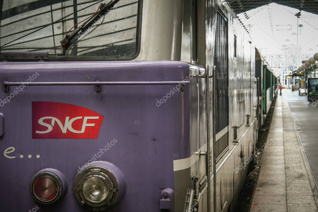 PARIS, FRANCE - JULY 13, 2011: Regional train with the logo of SNCF French Railways on a platform of Paris Gare du Nord Train station. This station is one of Paris main hubs