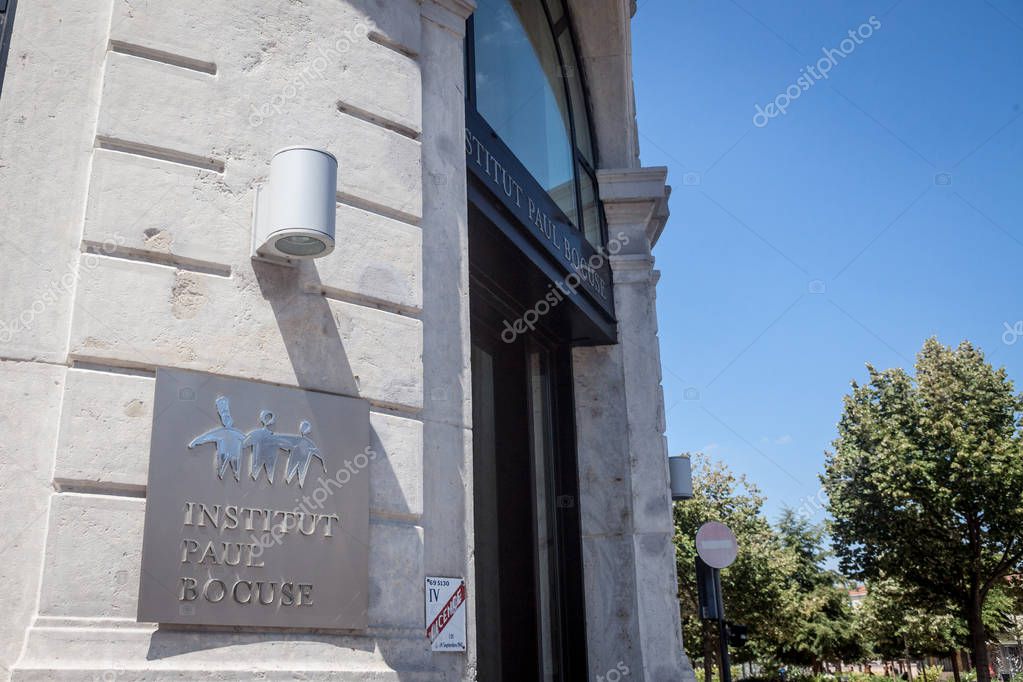 LYON, FRANCE - JULY 19, 2019: Institut Paul Bocuse logo in front of their main entrance in Lyon. Paul Bocuse Institute is a management and training school for the hotel, catering and culinary arts