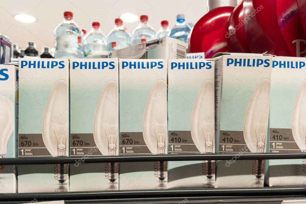 BELGRADE, SERBIA - SEPTEMBER 17, 2020: Logo of Philips on Incandescent Filament light bulbs for sale. Philips is an industrial conglomerate. Incandescent lightbulbs are being replaced for energy reasons