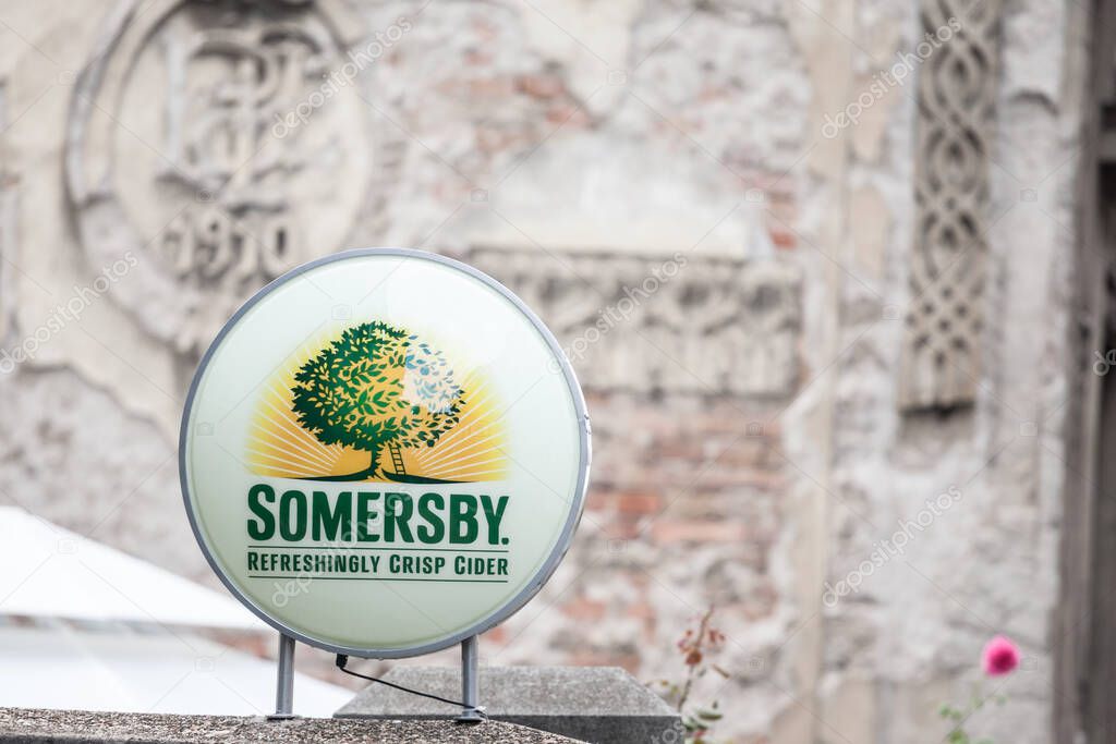BELGRADE, SERBIA - JULY 19, 2019: Somersby logo in front of the entrance to a retailer bar in Belgrade. Part of Carlsberg, Somersby is a danish brand of apple and flavored cider