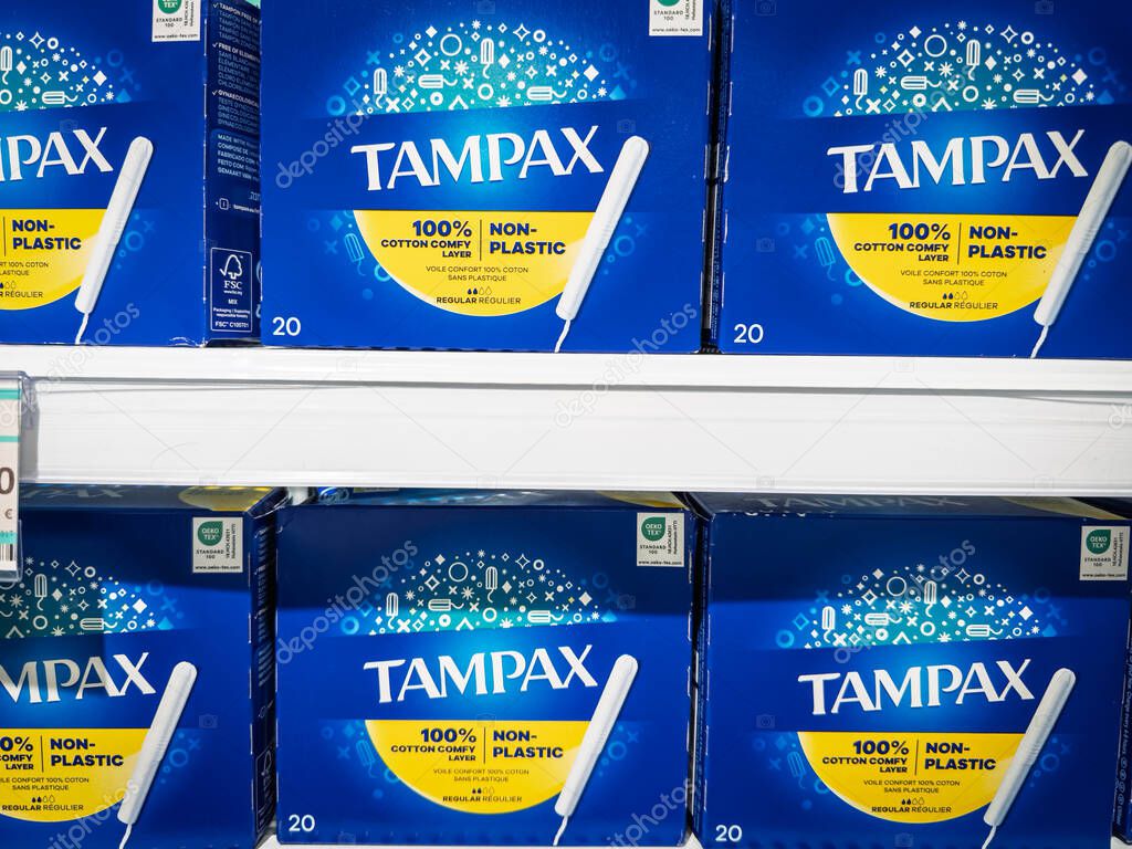 VALENCIA, SPAIN - APRIL 6, 2025: Boxes of Tampax tampons are displayed on a supermarket shelf in Valencia. Part of Procter and Gamble, Tampax is a brand of female hygiene products.