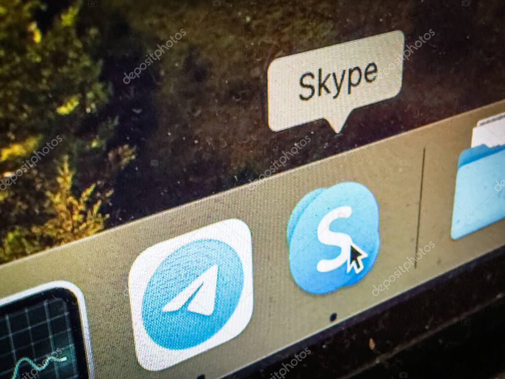 BELGRADE, SERBIA - MAY 6, 2025: Close view of a computer dock showing Skype and Telegram icons, illustrating messaging software and the shift from older services toward newer communication platforms.