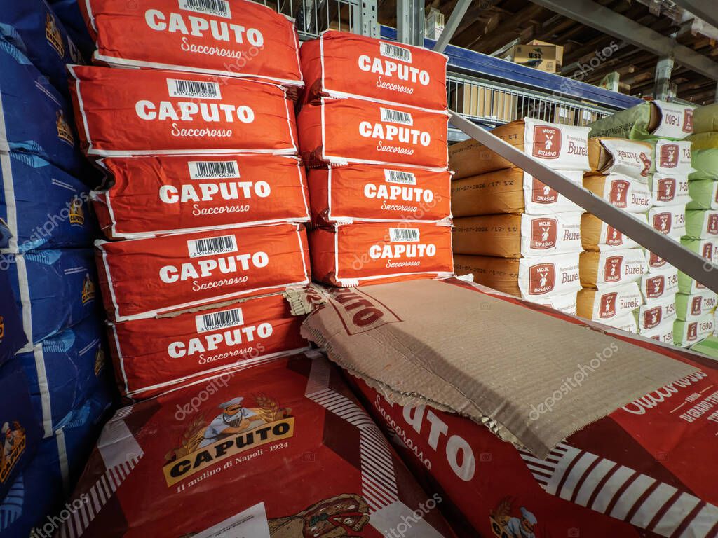 BELGRADE, SERBIA - AUGUST 9, 2025: Stacked red sacks of Caputo Saccorosso pizza flour on a supermarket pallet in Belgrade, a 00 flour for pizzerias and bakers. Caputo is an italian brand of flour.