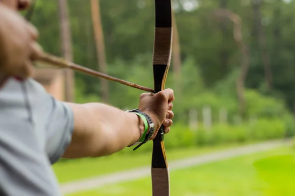 Aiming archers on the green clear background — Stock Photo, Image