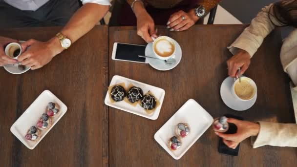 Freshly baked blueberry muffins in a rustic setting with milk and coffee on the table overhead shot with copyspace — Stock Video