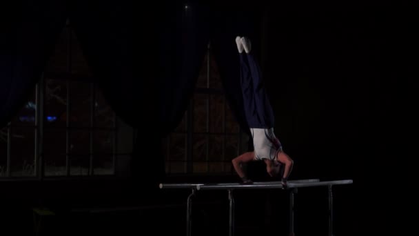 Portrait of young man gymnasts competing in the stadium — Stock Video