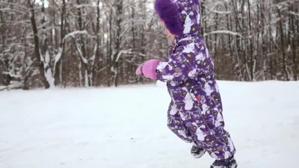 Happy Laughing Toddler Girl Wearing White Jacket Red Knitted Hat — Stock Video