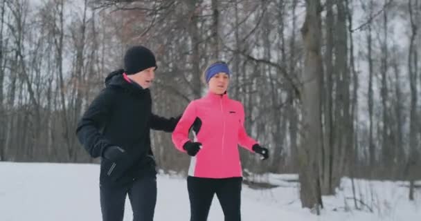 Happy young couple married sports morning and evening jogging in the park. — Stock Video