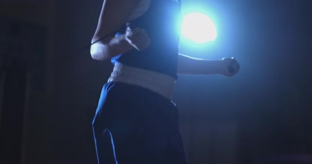 Close-up of the boxers hand in time jumping rope — Stock Video
