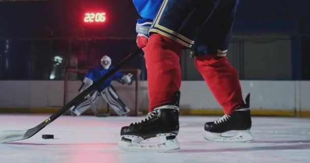 Close-up slow motion hockey puck kick and flying snow. A spectacular blow — Stock Video